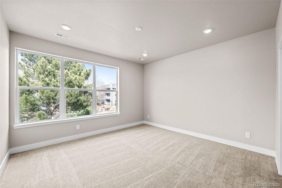 Spacious, unfurnished interior of a new home in Ralston Creek, Arvada (Image 24).