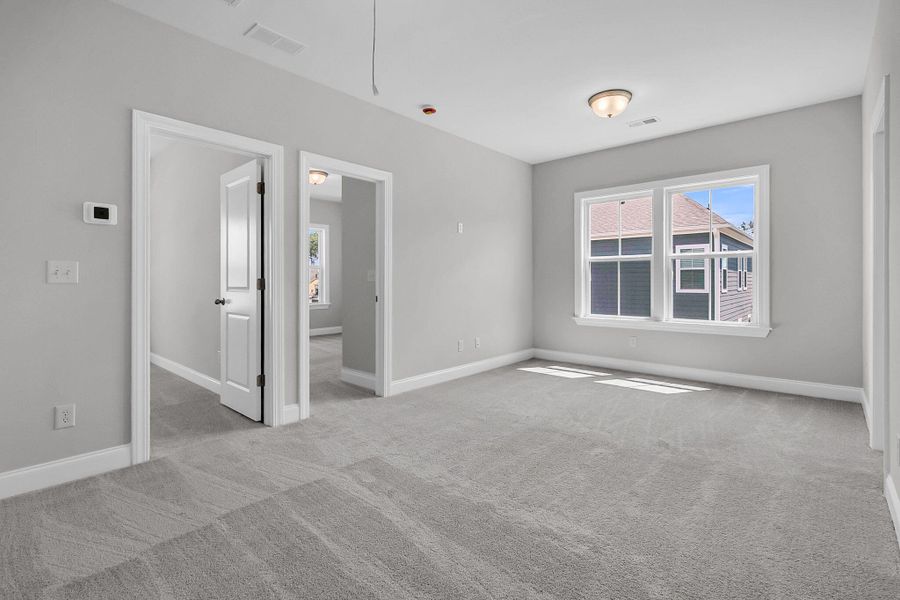 Spacious, unfurnished interior of a new home in Tidewater at Lakes of Cane Bay, Summerville (Image 26).