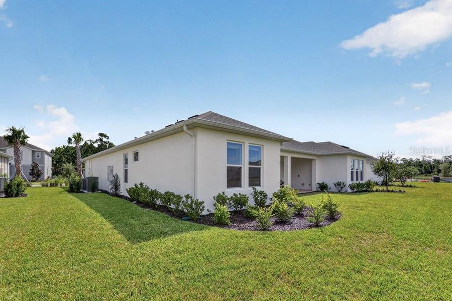 Exterior details and patio area of a home in Ardisia Park, New Smyrna Beach (Image 3).
