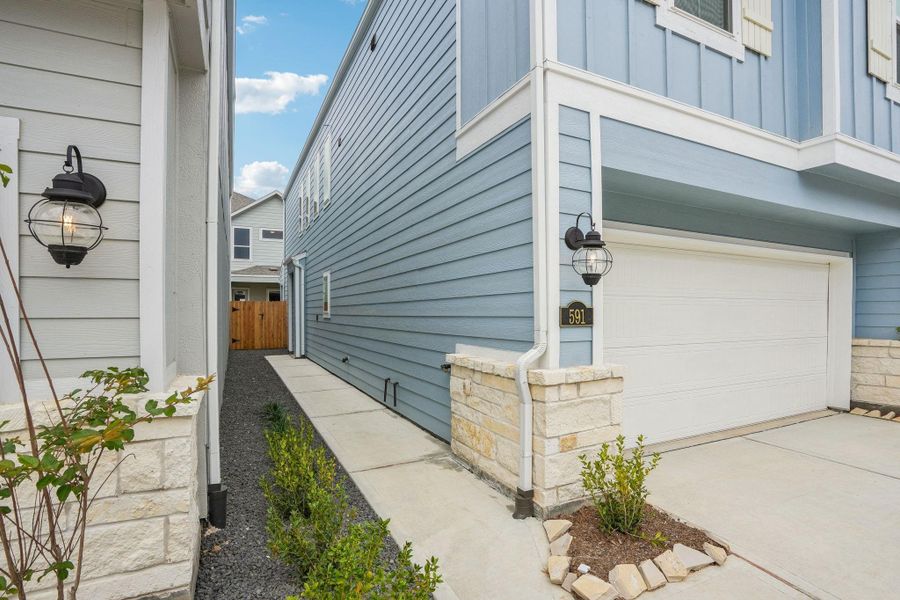Front exterior of a new home in Kemah Crossing - City Series, Kemah, TX, highlighting curb appeal (Image 24). Front exterior of a new home in Kemah Crossing - City Series, Kemah, TX, highlighting curb appeal (Image 24).