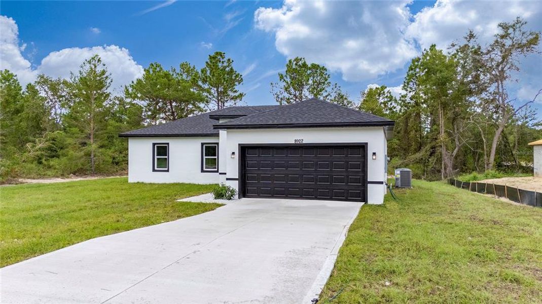 Front exterior of a new home in , Ocala, FL, highlighting curb appeal (Image 21).