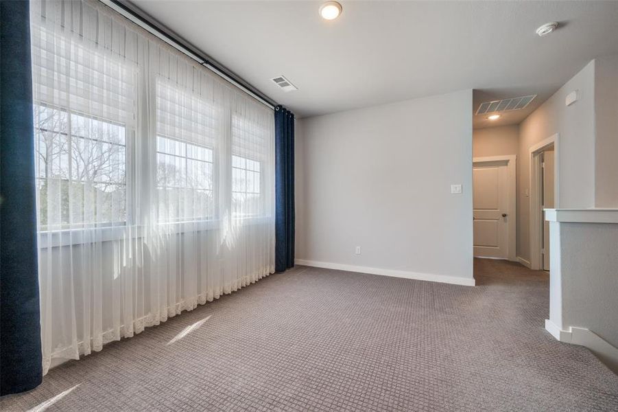 Spare room featuring recessed lighting, visible vents, carpet flooring, and baseboards