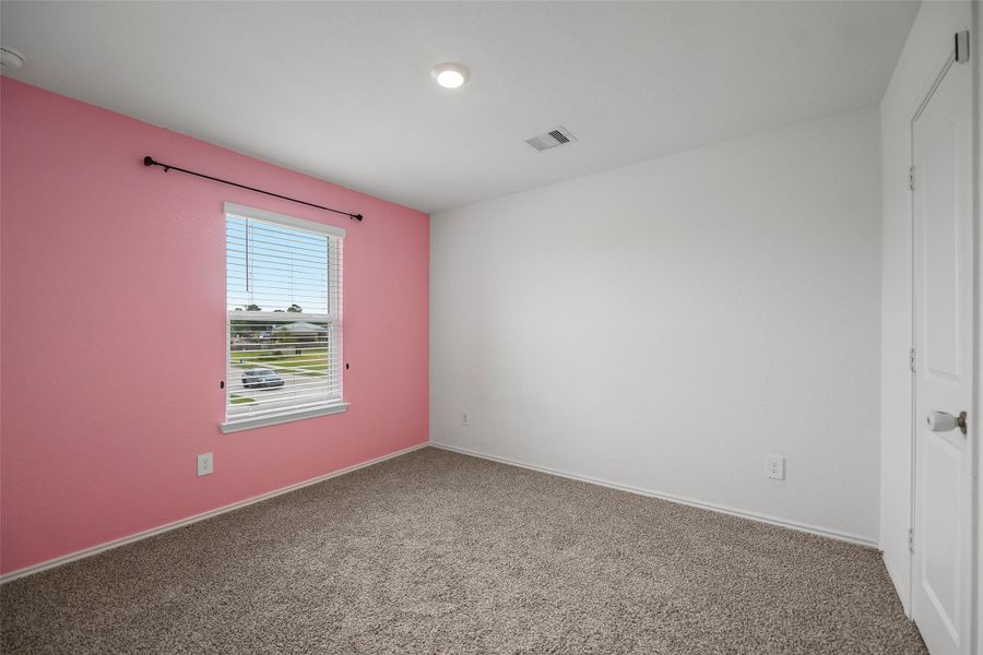 Well-sized upstairs bedroom with abundant natural light Well-sized upstairs bedroom with abundant natural light