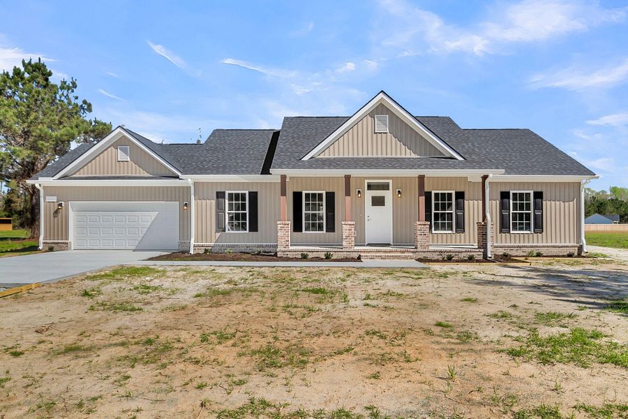 Front exterior of a new home in , Round O, SC, highlighting curb appeal (Image 22).