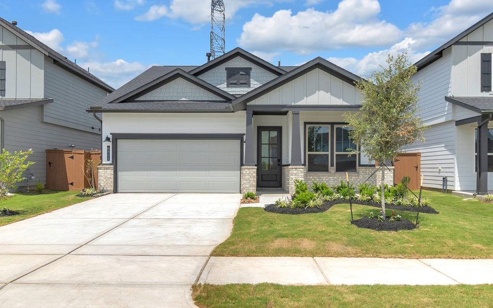 Front exterior of a new home in Elyson, Katy, TX, highlighting curb appeal (Image 1). Front exterior of a new home in Elyson, Katy, TX, highlighting curb appeal (Image 1).