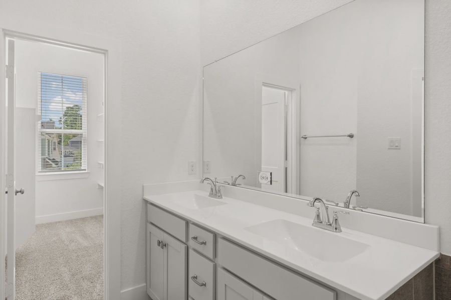 Representative furnished interior of a home built from the Margaux by Chesmar Homes in Meridiana Chateau, Manvel (Image 13).