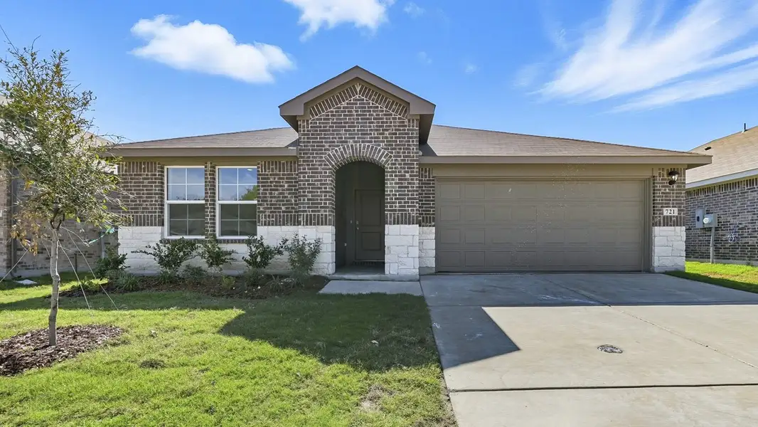 Front exterior of a new home in Sanger Circle, Sanger, TX, highlighting curb appeal (Image 1).