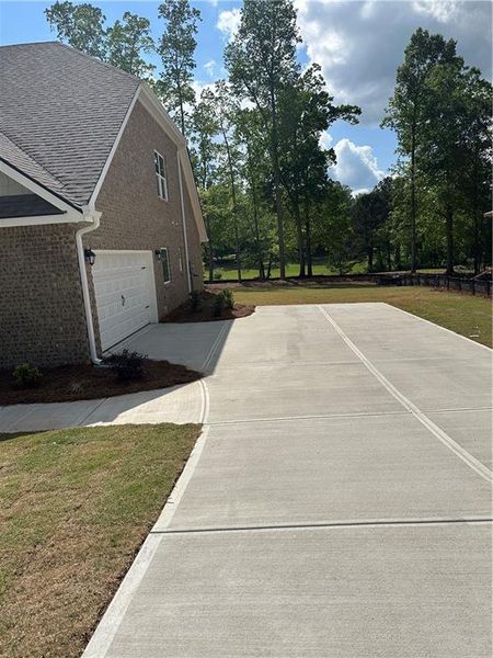 Exterior details and patio area of a home in Mirror Lake at South Harbour, Villa Rica (Image 28).