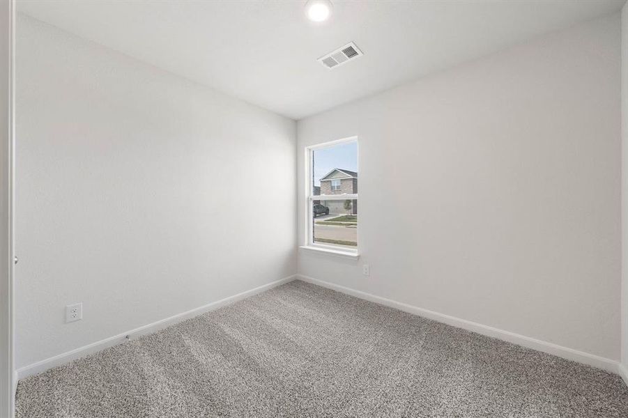 Unfurnished room featuring carpet flooring