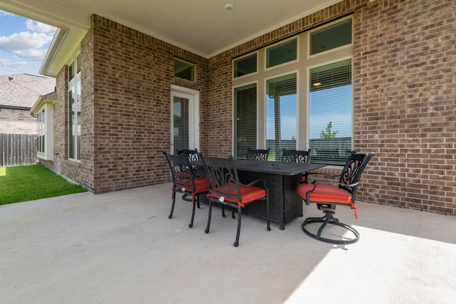This shows a large covered patio off of the family room and kitchen area. Nice outdoor shady spot for enjoying nature and group activities. This shows a large covered patio off of the family room and kitchen area. Nice outdoor shady spot for enjoying nature and group activities.