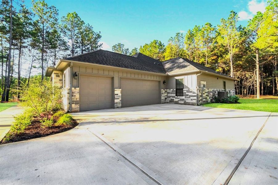 Oversized 3-car garage boasts a workshop.