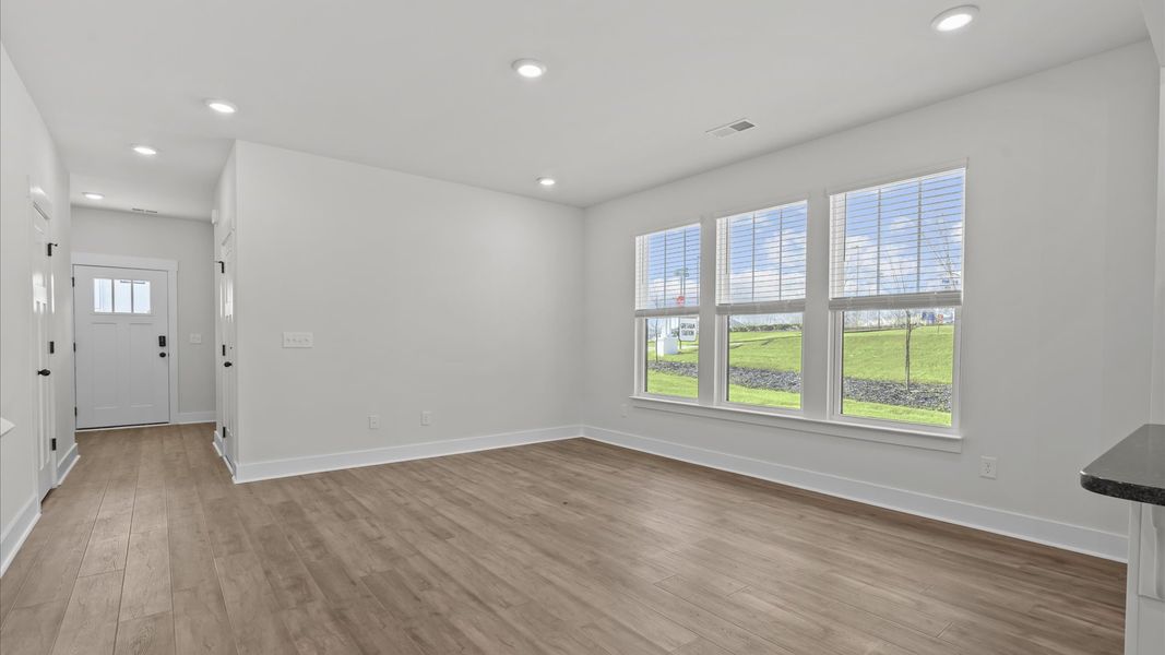 Accomplished layout centers around a spacious family room with exceptional flow and flexibility