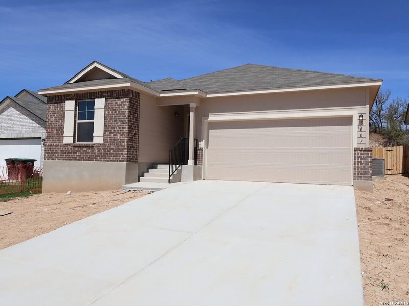 Front exterior of a new home in Agave, San Antonio, TX, highlighting curb appeal (Image 1). Front exterior of a new home in Agave, San Antonio, TX, highlighting curb appeal (Image 1).