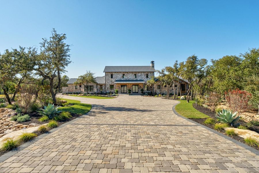 Front exterior of a new home in , Dripping Springs, TX, highlighting curb appeal (Image 26).