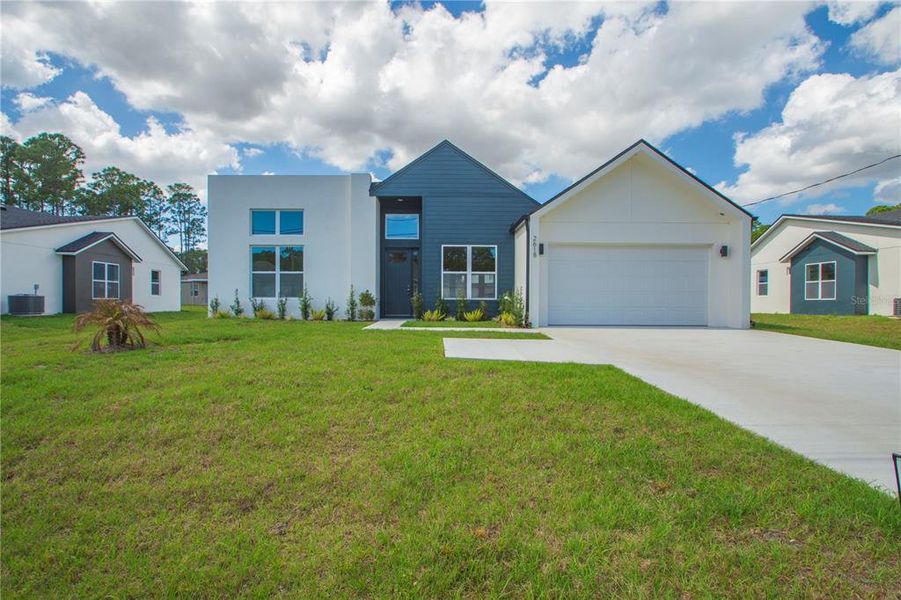 Front exterior of a new home in , Palm Bay, FL, highlighting curb appeal (Image 17).