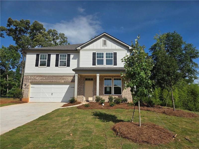 Front exterior of a new home in , Locust Grove, GA, highlighting curb appeal (Image 1). Front exterior of a new home in , Locust Grove, GA, highlighting curb appeal (Image 1).
