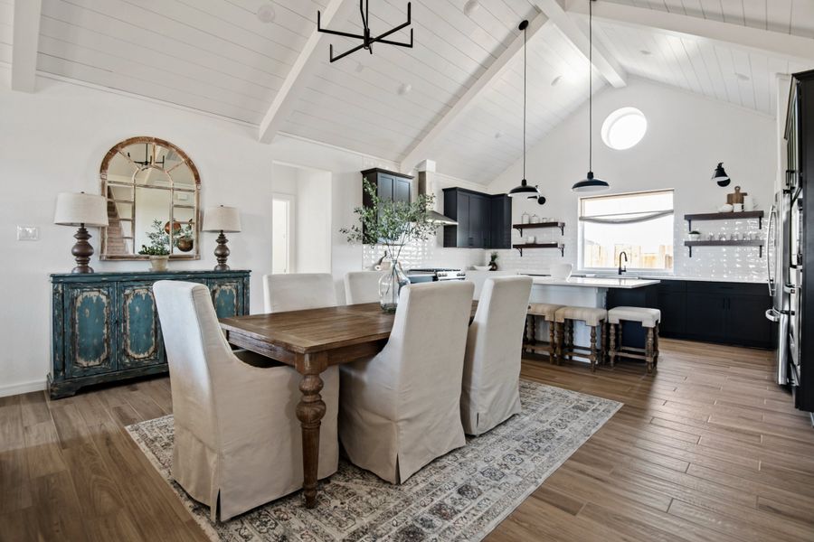 Dining area & great room with vaulted ceiling and optional white-painted ceiling beams Dining area & great room with vaulted ceiling and optional white-painted ceiling beams