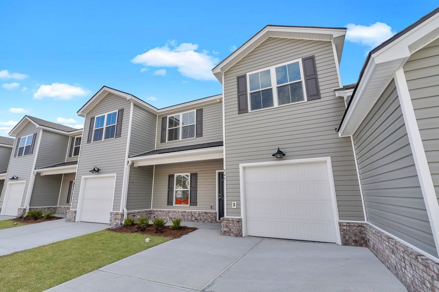 Representative exterior photo of a completed home built from the New Haven Town B by Ernest Homes in New Haven At Belmont Glen, Guyton, GA (Image 29). Representative exterior photo of a completed home built from the New Haven Town B by Ernest Homes in New Haven At Belmont Glen, Guyton, GA (Image 29).