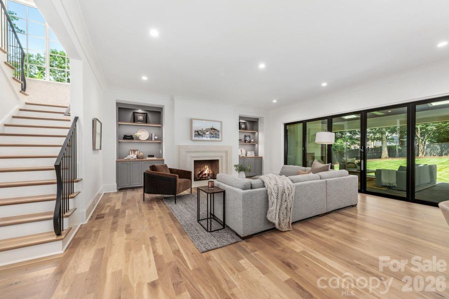 Open living spaces with built ins and fireplace