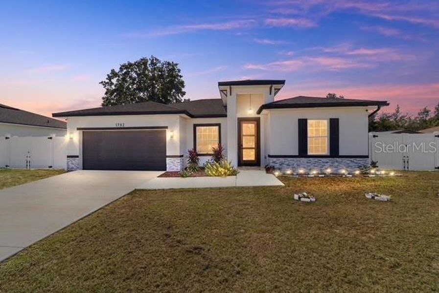 Front exterior of a new home in , Ocala, FL, highlighting curb appeal (Image 21).