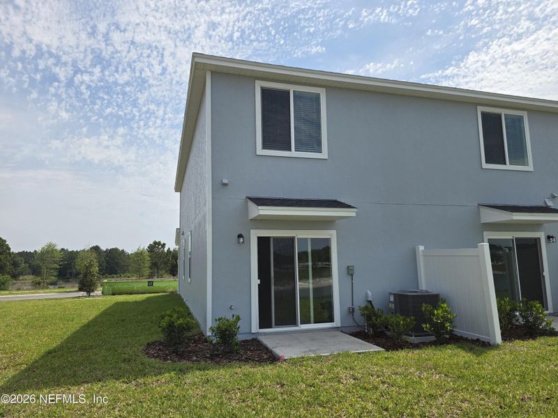 Exterior details and patio area of a home in The District at Oakleaf - The Commons, Middleburg (Image 3).