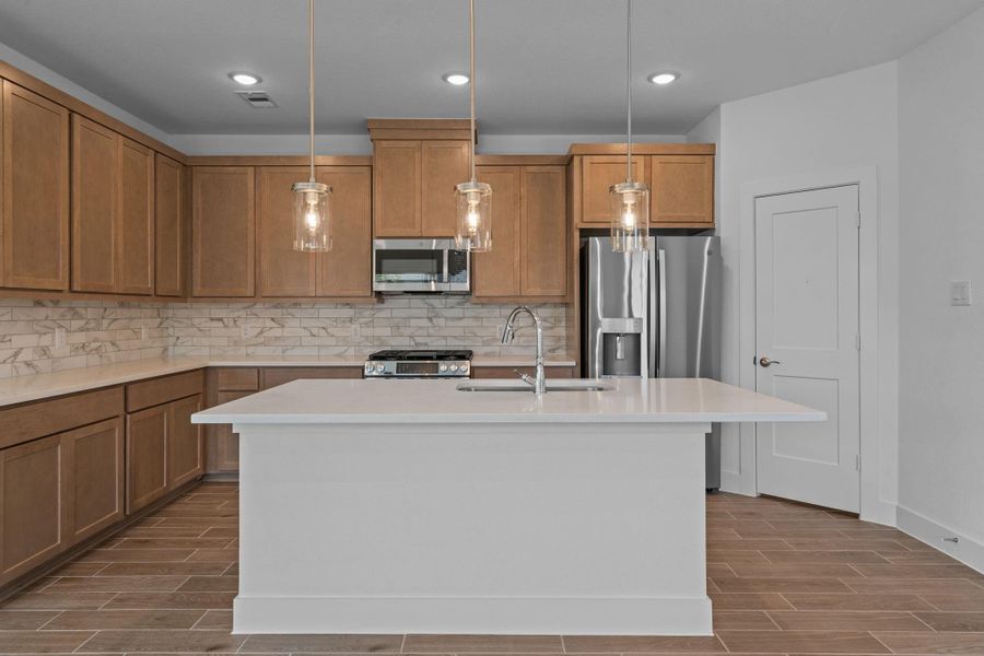 Furnished interior view inside a new home in Meridiana, Iowa Colony (Image 8).