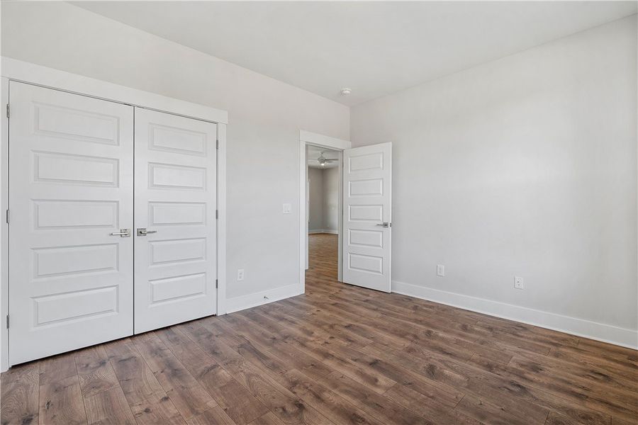 Rich wood plank flooring sets the tone for comfort