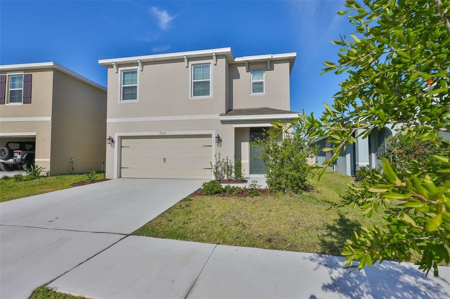 Front exterior of a new home in Southshore Bay, Wimauma, FL, highlighting curb appeal (Image 24). Front exterior of a new home in Southshore Bay, Wimauma, FL, highlighting curb appeal (Image 24).