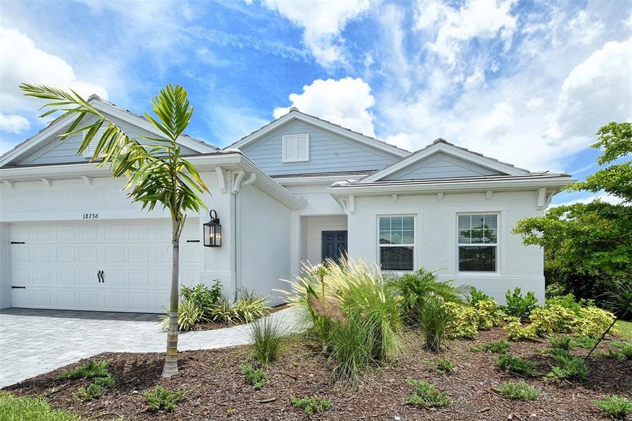 Front exterior of a new home in , Venice, FL, highlighting curb appeal (Image 1).