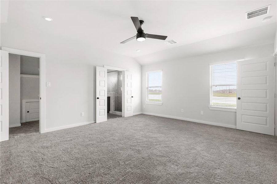 Primary room with lots of natural light, including window view of lake.