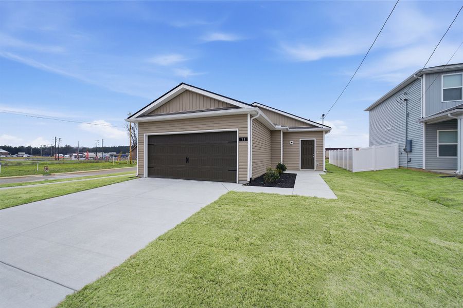 Front exterior of a new home in Stonehenge, Manchester, TN, highlighting curb appeal (Image 16). Front exterior of a new home in Stonehenge, Manchester, TN, highlighting curb appeal (Image 16).