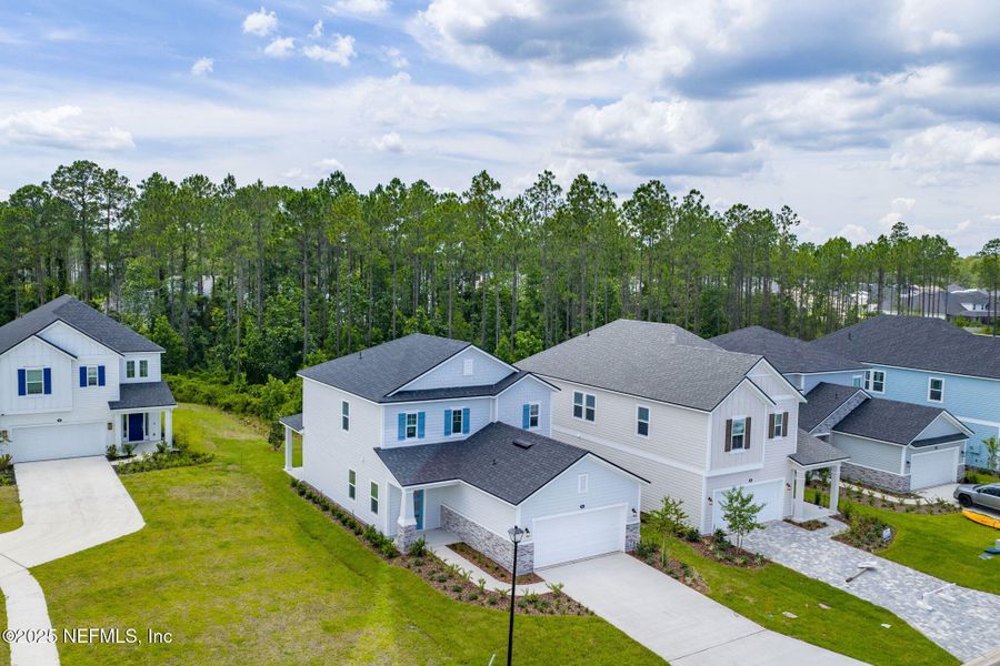 Front exterior of a new home in Beacon Lake, St. Augustine, FL, highlighting curb appeal (Image 28).