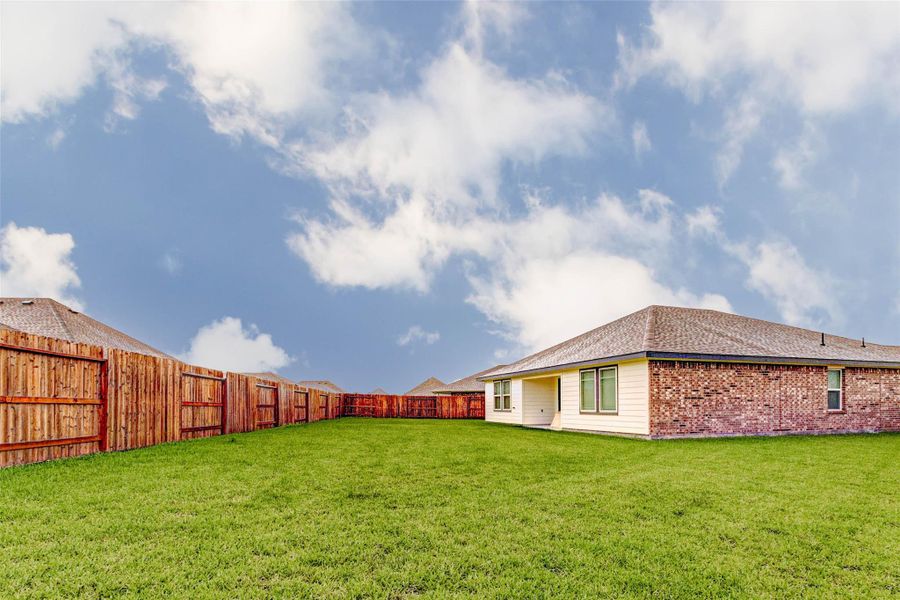 Exterior details and patio area of a home in Canterra Creek 45' and 50' Homesites, Iowa Colony (Image 3).