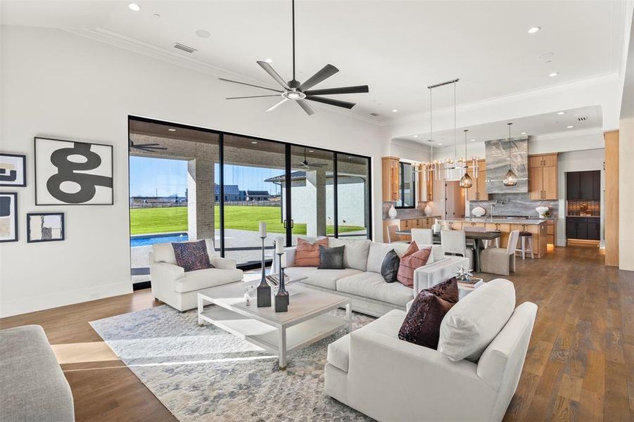 Another view of the great room looking out onto another outdoor living space/pool.