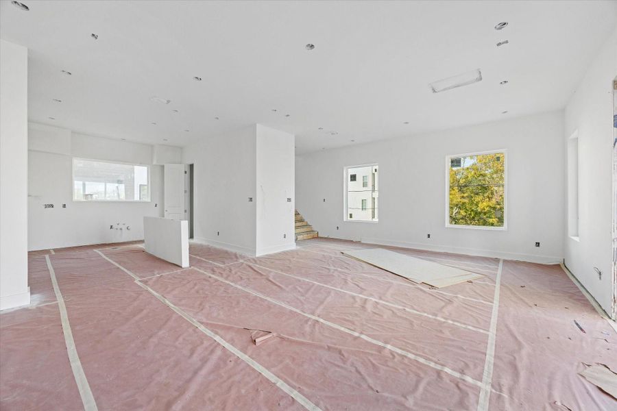 View from the living room looking at the kitchen and dining area as of December 12, 2025.
