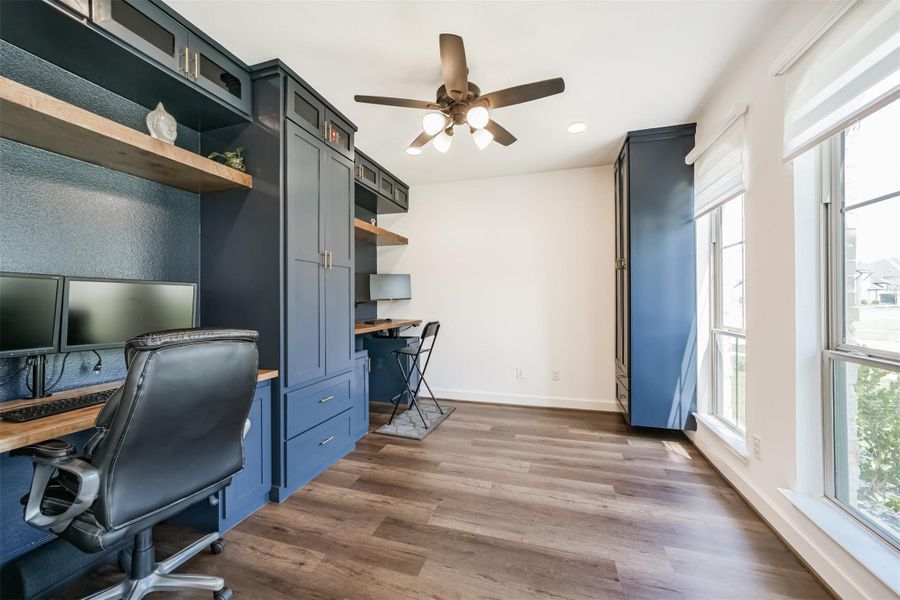 Custom office built-ins featuring dual sit-stand desks, sleek cabinetry, and discreetly concealed wiring—perfectly designed for a modern, functional workspace. Custom office built-ins featuring dual sit-stand desks, sleek cabinetry, and discreetly concealed wiring—perfectly designed for a modern, functional workspace.