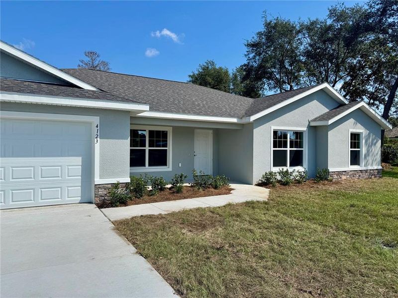 Front exterior of a new home in , Dunnellon, FL, highlighting curb appeal (Image 19).