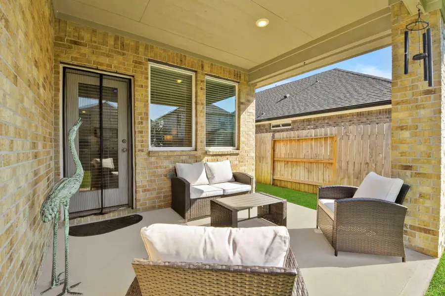 Exterior details and patio area of a home in Harper's Preserve - Traditional Series, Conroe (Image 2).