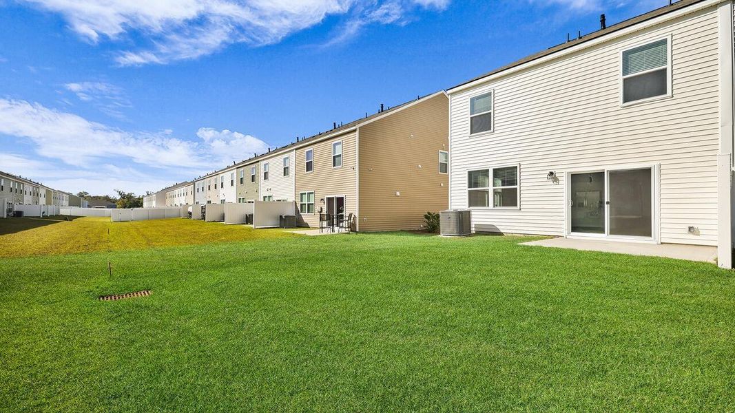 Exterior details and patio area of a home in Carolina Groves Townhomes, Moncks Corner (Image 14). Exterior details and patio area of a home in Carolina Groves Townhomes, Moncks Corner (Image 14).