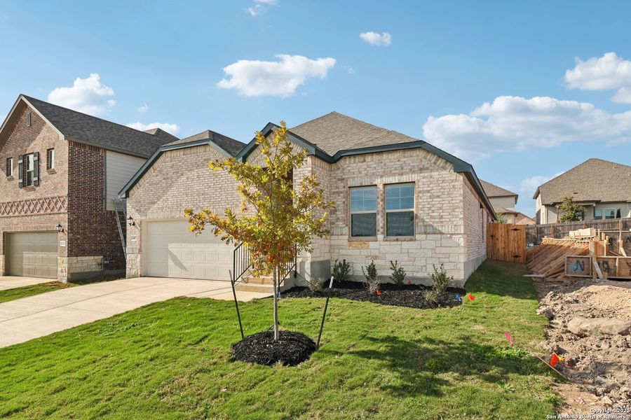 Front exterior of a new home in Arcadia Ridge - Classic Series, San Antonio, TX, highlighting curb appeal (Image 23).
