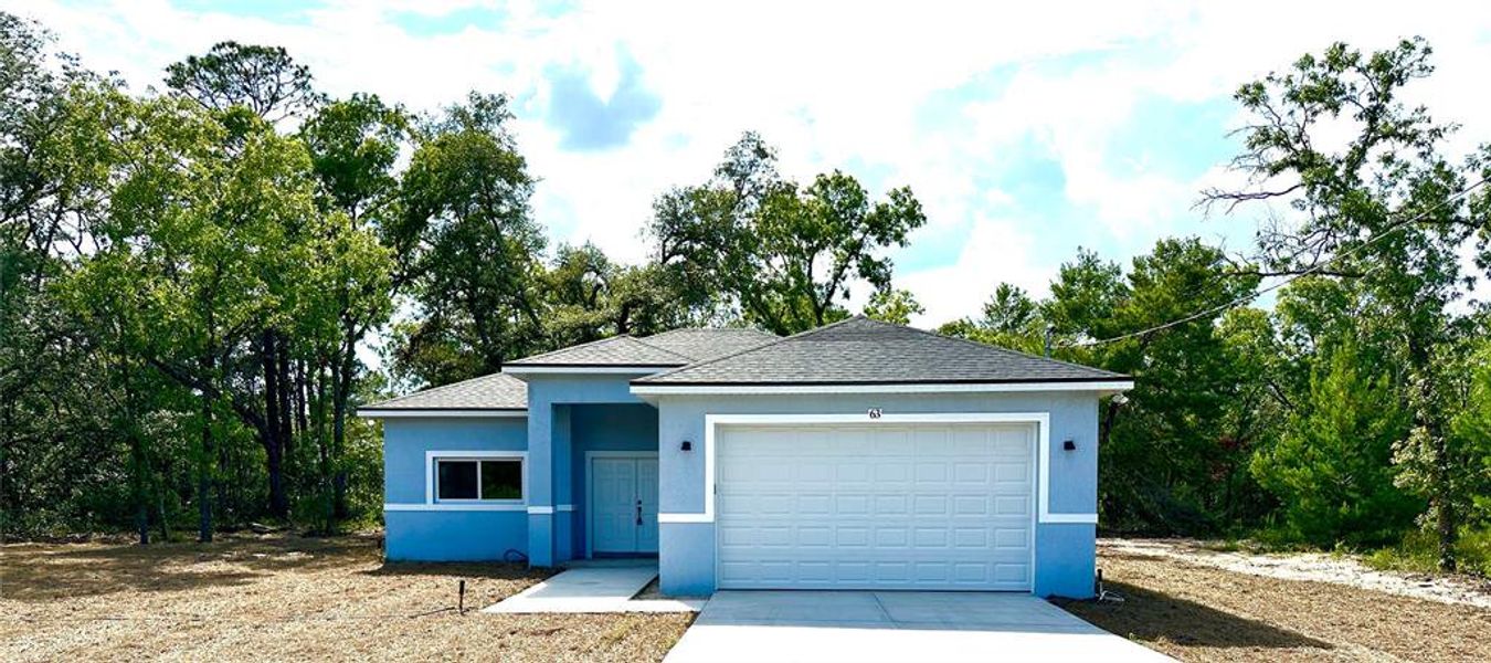 Front exterior of a new home in , Ocklawaha, FL, highlighting curb appeal (Image 2). Front exterior of a new home in , Ocklawaha, FL, highlighting curb appeal (Image 2).