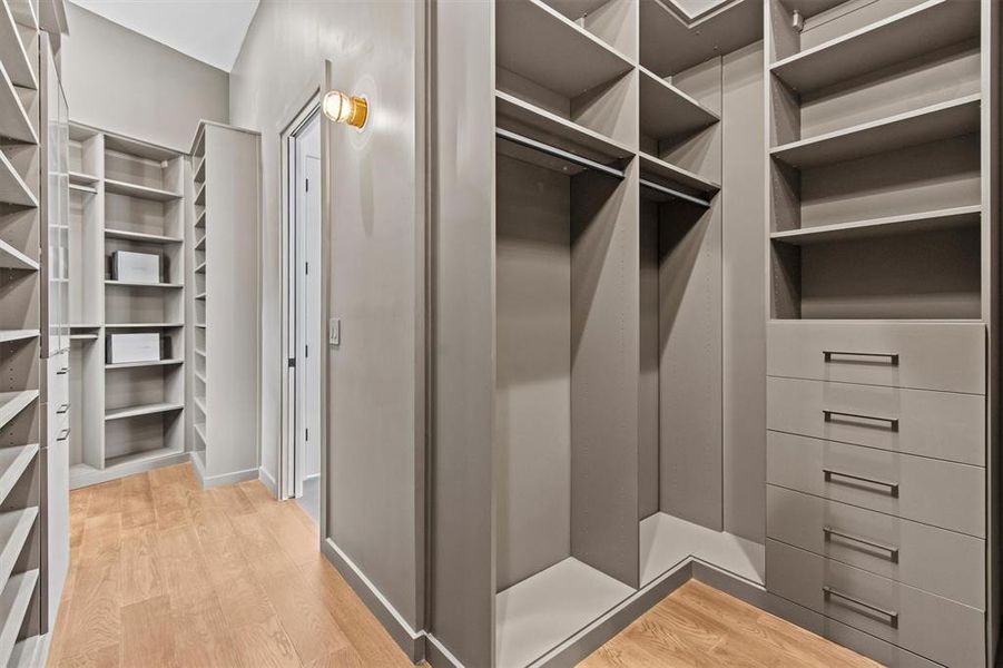 California Closets designed walk-in closet with abundant storage, ensuring your wardrobe is always impeccably organized.