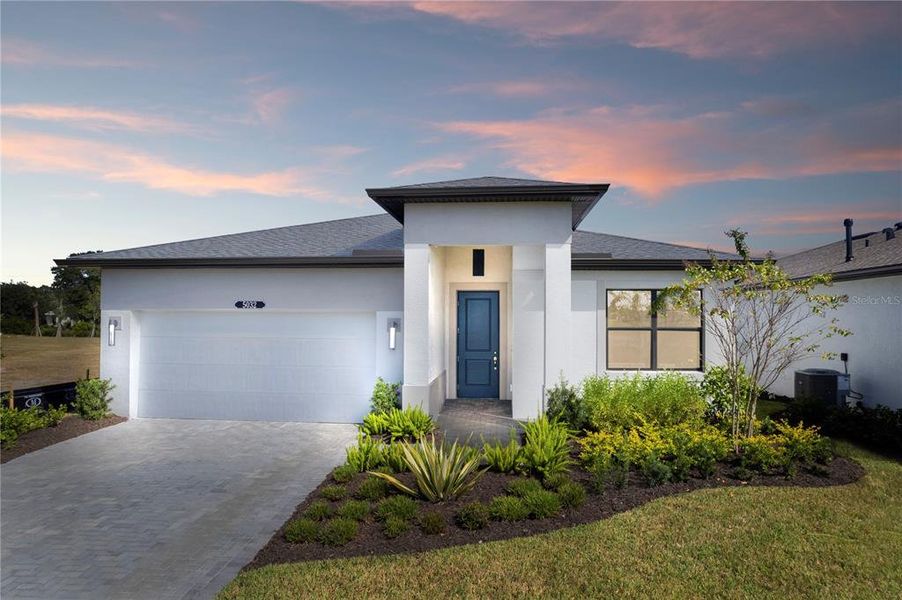 Front exterior of a new home in Woodland Preserve, Parrish, FL, highlighting curb appeal (Image 21).