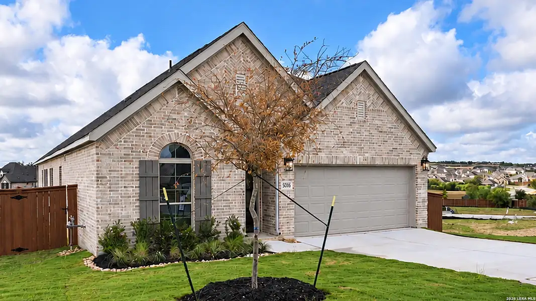 Front exterior of a new home in Homestead, Schertz, TX, highlighting curb appeal (Image 2). Front exterior of a new home in Homestead, Schertz, TX, highlighting curb appeal (Image 2).