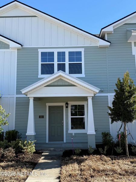 Front exterior of a new home in Liberty Cove, Yulee, FL, highlighting curb appeal (Image 2).