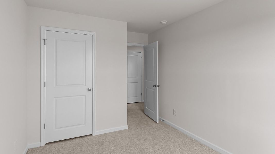 Spacious, unfurnished interior of a new home in Edinborough Townes, Gibsonville (Image 16).