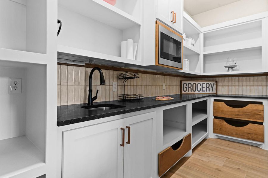 Storage area featuring a sink Storage area featuring a sink