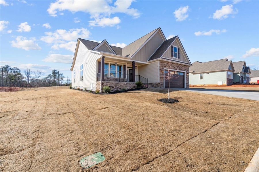 Representative exterior photo of a completed home built from the Caterina Elite by Enchanted Homes in Tubbs Mountain Estates, Travelers Rest, SC (Image 24).