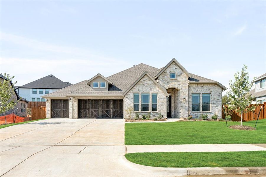 Front exterior of a new home in Rockwood 90, Mansfield, TX, highlighting curb appeal (Image 24). Front exterior of a new home in Rockwood 90, Mansfield, TX, highlighting curb appeal (Image 24).