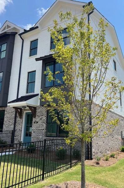 Front exterior of a new home in Palisades Townhomes, Cumming, GA, highlighting curb appeal (Image 29).